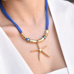 The Summer Edit Collection SOLARE – Κολιέ σε κοραλί τόνο με κρεμαστό μοτίφ ήλιο Eleven K Jewelry