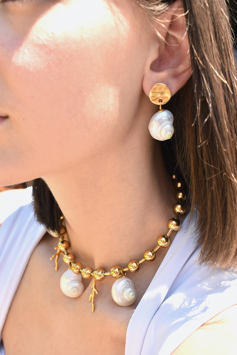 NEREA – Statement women’s shell earrings with natural shells and hammered gold-plated studs elevenkjewelry.com Earrings Earrings NEREA – Statement women’s shell earrings with natural shells and hammered gold-plated studs Eleven K Jewelry