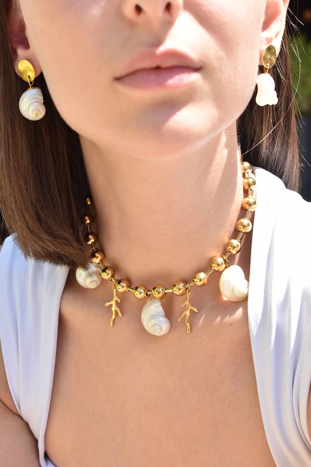NEREA – Statement necklace with natural shells & gold-plated details elevenkjewelry.com Eleven K -The Summer Edit Collection Eleven K -The Summer Edit Collection NEREA – Statement necklace with natural shells & gold-plated details Eleven K Jewelry